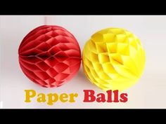 two red and yellow paper balls with the words paper balls written below them on white background