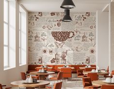 an empty restaurant with orange chairs and wooden tables in front of a large wall mural