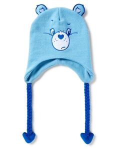 Stay warm, cozy, and cute with this Grumpy Care Bear laplander hat! This fun and attention-getting hat is perfect for any Care Bears fan! Officially licensed Adjustable Relaxed fit Material: Polyester Care: Spot clean Imported Care Bear Accessories, Cute Cap For Cold Weather, Cute Cold Weather Cap, Playful Hats For Cold Weather, Playful Cotton Winter Hat, Playful Warm Cotton Hat, Warm Cotton Playful Hat, Warm Playful Cotton Hat, Playful Warm Hat For Playtime