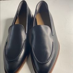 Black Leather Loafers Nib. There Is A Surface Scratch On One Shoe Probably From Someone Trying Them On. Look At Pic Two For Reference Sleek Black Loafers With Leather Sole, Black Flat Dress Shoes For Work, Black Plain Toe Loafers For Work, Black Leather Flats With Plain Toe, Black Leather Flat Oxfords, Black Plain Toe Moccasins For Work, Elegant Black Flats With Stitched Sole, Black Loafers With Leather Lining For Business Casual, Black Wingtip Loafers For Work