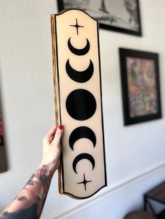 a person holding up a sign that says coco on the front and back of it