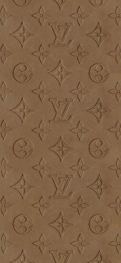 an image of a brown wallpaper with many different symbols on it and the words louis vuitton written in cursive writing