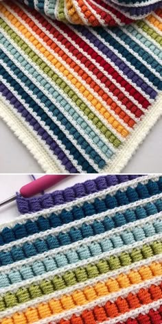 the crocheted blanket is being worked on with scissors and yarn in different colors