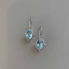 "925 sterling silver oval blue topaz earrings. Earrings measure 1/2\" W x 1\" L. Ear wire closure. Sky blue topaz gemstones. Check our other blue topaz items! Follow us on instagram @porterconradjewelry" New Canaan, Blue Topaz Earrings, Sky Blue Topaz, Topaz Earrings, Lovely Earrings, Blue Topaz Ring, Topaz Gemstone, Topaz Ring, Gorgeous Earrings