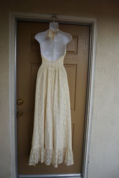 "Lovely lace prairie dress. Has the Gunne Sax style and look. No tags. Maxi length. Estimated size Small. Zips in back. Condition is good -no flaws to note! measurements taken across front lying flat Length50\" armpit to bottom Bust16.5\" laying flat Waist12.5\" empire Hips30\"" Beige Lace Floor-length Maxi Dress, Fitted Cream Backless Maxi Dress, Beige Maxi Dress With Lace Patchwork, Formal Maxi Dress With Delicate Lace, Delicate Lace Floor-length Maxi Dress, Cream Maxi Dress With Lace Patchwork, Cream Lace Sleeveless Maxi Dress, Spring Floor-length Maxi Dress With Delicate Lace, Fitted Cream Maxi Dress Floor-length