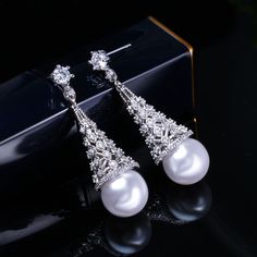 CZ Jewelry- Elegant Women Simulated Pearl Jewelry For Party Gift Big Crystal Stone Paved Silver Color Long Dangle Drop Earrings Model Number:32882237302 Earrings Size : 4.2 cm Brand : Pera Jewelry Item Type : Luxury Women Party Earrings For Gift Material : Cubic Zirconia Main Colors : White Party Earrings, Cz Jewelry, Women Party, Big Earrings, Crystal Stone, Ladies Party, Luxury Women, Earrings Jewelry, Elegant Woman