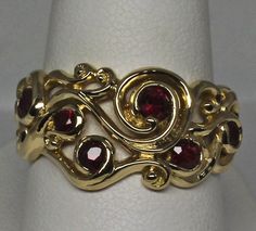 Ruby Swirl ring in 18k yellow gold with natural Rubies size 6.25 The ruby swirl ring design was inspired by the fables surrounding the Arthurian legends. Swirls of gold make up the ring. Rubies burn within the golden swirls invoking the magic that I feel must have been present in the mists surrounding the fabled island. I've set 1.08cts total weight of very fine rubies in this ring. Some of the rubies have a few flaws but nothing that detracts from their beauty. All of the stones are natural and Unique Yellow Gold Ruby Ring, Unique 14k Yellow Gold Ruby Ring, Gold Ruby Rings With Intricate Design, Fine Jewelry Yellow Gold Ruby Ring With Intricate Design, Yellow Gold Ruby Ring With Intricate Design, 14k Yellow Gold Ruby Ring With Intricate Design, Intricate Ruby Ring Jewelry, Ornate Gold Rings With Ruby, Gold Make Up