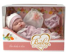 a baby doll in a pink box with a white hat