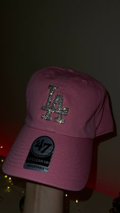 Custom LA Dodgers 47 clean up adjustable hat with perfect shine of Swarovski crystals. Every crystal is hand placed by me. Pink Fitted Hat, Hat With Rhinestones, Vintage Fitted Pink Hat, Bling Dodgers Hat, Pink Ny Hat, Adjustable Baseball Cap With Bling, Adjustable Rhinestone Baseball Cap With Curved Brim, Rhinestone Fitted Cap, 2000 Vibes