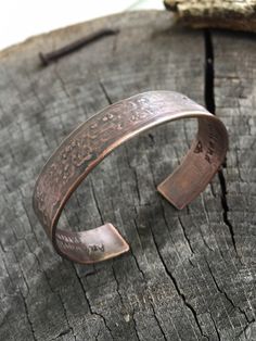 These cuff bracelets make the perfect sentimental gift for your special guy or gal. They're perfect for the 7th Anniversary, birthday, wedding or just because. Each is custom crafted from pure, organic copper with your special message hand stamped & hidden on the inside (or outside if you prefer). HOW TO ORDER: 1. Choose your wrist size from the dropdown menu at checkout 2. Choose your font from the dropdown menu 3. Leave at note to seller at checkout that includes your custom message, any s Adjustable Bangle Cuff Bracelet For Anniversary, Handmade Spiritual Cuff Bracelet For Anniversary, Spiritual Handmade Cuff Bracelet For Anniversary, Etched Bangle Cuff Bracelet For Anniversary, Handmade Adjustable Cuff Bracelet For Anniversary, Adjustable Spiritual Jewelry For Anniversary Gift, Adjustable Etched Bracelets For Anniversary, Engraved Cuff Bracelet As Gift, Engraved Cuff Bracelet Gift