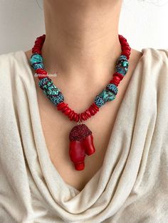 ✨Make a bold statement with our **Gold-Plated Boho Chic Necklace featuring large **Red Coral** and **Turquoise Beads**. This handcrafted piece is designed for those who love a blend of natural elements and elegant sparkle. ✨ **Eye-Catching Materials The necklace showcases large turquoise stones adorned with rhinestones, paired with vibrant red coral beads. The gold plating enhances the bohemian elegance, making this a standout accessory. 💎 **Stunning Red Coral Pendant The focal point of the nec Red Natural Stones Beaded Necklace, Red Bohemian Beaded Necklaces With Stones, Bohemian Red Beaded Necklaces With Stones, Bold Red Handmade Necklace, Handmade Red Turquoise Necklace For Jewelry Making, Handmade Red Artisan Turquoise Necklace, Unique Red Stone Necklaces, Vibrant Red Handmade Beaded Necklace, Handmade Vibrant Red Beaded Necklaces