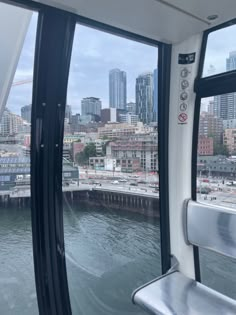 the view from inside a boat looking out at a city