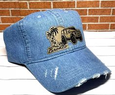 Bronco Hat - Denim Distressed Ponytail Bronco Custom Leatherette Patch Hat  Custom made leatherette patch attached to ponytail hat.  One size fit all.  Each hat looks slightly different in distressed look. Each patch is custom engraved so may look slightly different from the picture.   We do not recommend machine wash.  Hand wash only.   Please check out our store for hat designs that might catch your eye. Shipping:  All of our shipping comes with a tracking number to monitor your purchase. We a Bronco Custom, Patch Hat, Ponytail Hat, Hat Custom, Pompano Beach, Business Thank You, Hat Designs, Trucker Cap, One Size Fits All