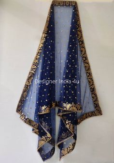 Blue Net Dupatta for women. Dupatta is custom made for bridal weddings It is made using dyeable net fabric with golden Sequines work all over. A Banarsi Brocade border along with Golden beaded lace is attached to dupatta. Dupatta is having a length of 100 inches and width of around 40 inches. I don't keep it readymade I only make it exclusively for my customers. Can be fully customised. Kurti Ideas, Lehenga For Girls, Blue Dupatta, Blue Color Combinations, Bridal Dupatta, Lehenga Suit, Border Lace, Indian Blouse, Stole Scarf