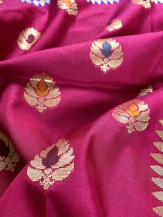 Gorgeous and Rich Saree in Banarasi Handloom Silk with Meenakari and Zari Work Item : Saree Color : Pink and Blue Base Fabric : Banarasi Silk Blouse piece : Yes Blouse material : Banarasi Silk Work : Handloom, Meenakari Work and Tassels Fall & Edging(Pico) Yes/No : Yes Kindly note : Since this Saree is handmade hence little inconsistencies may be there however it is not considered as a defect. Every Saree is unique in its own way and weavers put in there heart and soul in weaving these beaut Pink Banarasi Silk Saree, Banarasi Silk Saree, Zari Work, Cute Boutiques, Blouse Material, Blouse Piece, Salwar Kameez, Silk Blouse, Dark Pink