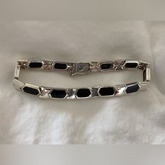 Gorgeous Black Onyx And Sterling Silver Bracelet. Never Worn. Beautiful Clasp. Solid Well Made Piece. Classic Silver Bracelet With Black Enamel, Elegant Silver Bracelet With Black Enamel, Classic Silver Onyx Bracelets, Black Polished Finish Bracelet For Formal Occasions, Elegant Silver Onyx Bracelet, Elegant Black Sterling Silver Bracelet With Polished Finish, Black Onyx Bracelet, Beautifully Made, Onyx Bracelet