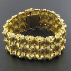 This is part of Chairish’s Fine Jewelry assortment.  18 carat yellow gold bracelet, rhinoceros head hallmark.  Fully articulated, this splendid bracelet is formed of articulated motifs made of ribbons of chiseled gold spaced with small golden pearls.  The clasp is with 8 safety.  Length: 18.5 cm, width at widest: 2.7 cm, thickness at widest: 5.9 mm.  Total weight of the bracelet: 71.2 g approximately.  Authentic antique jewel-French work from the end of the 19th century.  Our opinion: Rare of th Ribbon Bracelet, Ribbon Bracelets, Gold Ribbon, Gold Ribbons, Yellow Gold Bracelet, Vintage Cartier Bracelet, Dior Ring, Gold Gold, Vintage Cartier