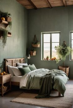 a bed sitting in a bedroom next to two windows with potted plants on them