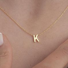 The Handmade 3D Block Letter Necklace gold, which we offer in 925 Sterling Silver or 14 Karat Gold, is the perfect gift for Mothers Day. The 14K solid version of the mothers day necklace gift also comes with a 14K solid gold chain. This handmade birthstone and letter necklace gold anniversary gift is Silver or gold and perfect Made with quality.  PRODUCT HIGHLIGHTS  Made of high quality 925 Sterling Silver or 14K Solid Gold Necklaces for Women. You can personalize this silver necklace with your or your loved ones' names. For further customization requests, please contact us using Etsy messages. Available in Silver, Gold and Rose Gold Colors for the Silver version. Available in White Gold, Yellow Gold and Rose Gold for the 14K Solid Gold Edition.  HOW TO ORDER  Please select your necklace m Gold Letter Pendants, Letter Necklace Gold, Gift Letter, Letter Necklace Silver, Gold Letter Necklace, Gift For Mothers Day, Letter Gifts, Solid Gold Necklace, Gold Anniversary