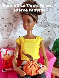 a barbie doll sitting on top of a pink chair with a purse in her hand