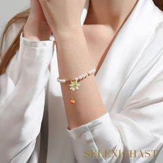 Plating: 18K Gold Materials: 18K Gold on Brass, Cubic Zirconia Measurements: Length: 6.69"(16.5cm) + Extender: 2.36"(6cm) Weight: 17g Beaded Bracelets With Pearl Charm For Gift, Flower Shaped Pearl Charm Jewelry Gift, Orange Flower Bracelet For Gift, Beaded Bracelets With Flower Charm For Gift, Elegant Orange Bracelet For Gift, Spiritual Orange Beaded Bracelet, Elegant Adjustable Apricot Jewelry, Elegant Orange Pearl Drop Jewelry, Elegant Orange Wedding Bracelets