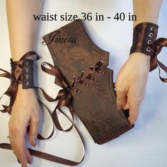 Beautiful cuffs bracelet and corset belt for an added embellishment to your outfit. Make any outfit look stylish! Perfect pieces for an alternative or Gothic wedding, cosplay, medieval, prom.  Includes corset belt and wrist cuffs.  The sizes in this listing: 35 - 40 inches. Link to corset belt and cuff bracelet sizes: 26 inches - 30 inches - https://jinesadesign.etsy.com/listing/1386757050/ 31 inches - 35 inches -https://www.etsy.com/listing/1740652186/ Detachable cuffs included 2 pcs.  Cuff wid Brown Corset Outfit, Bracelet Wrist Tattoo, Detachable Cuffs, Brown Corset, Medieval Belt, Bracelets Vintage, Corset Outfit, Wrist Bracelet, Gothic Corset