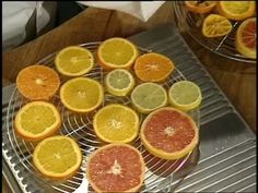 oranges and grapefruits are arranged on a cooling rack in preparation to be cooked