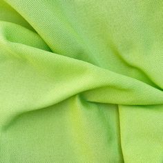 a close up view of a green fabric