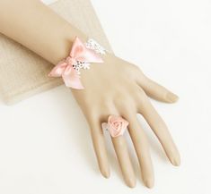 Buy Sweet Pink Bow Rose Girls Lolita Bracelet And Ring Set on Lolitain.com. Choose your perfect classic lolita dress, gothic lolita dress, and more. Regular discounts up to 50% off. Baroque Jewelry, Bridesmaid Rings, Ring Bracelet Chain, Lace Bracelet, Bow Bracelet, Lace Bands, Bracelet Accessories, Ring Chain, White Bracelets