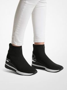 Our Skyler sock sneakers are renewed in a high-top silhouette crafted from a stretch-knit fabric with patent leather at the heel. Comfortable yet refined, this pair is a chic finish to casual looks. Sporty High Ankle Sneakers For Fall, Modern High-top Sneakers For Spring, Textile Sneakers For Fall, Fall Textile Sneakers, Slip-on High-top Sneakers For Fall, Fall High-top Slip-on Sneakers, Sock Sneakers, Top Handbags, Most Comfortable Shoes