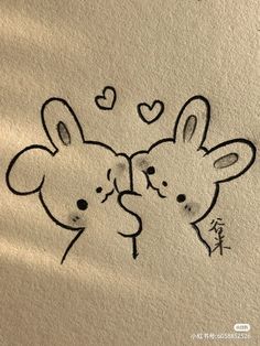 two animals with hearts drawn on the wall