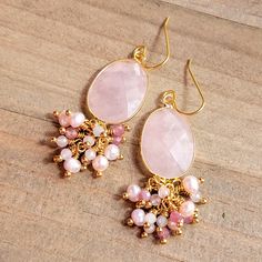 These beauties will adorn your ears with great elegance. Faceted rose quartz Facet pink Tourmaline gemstones Faceted pale blue Morganite gemstones Pink freshwater pearls 10k gold plate ear hooks 18k gold plate wire Length 2.5" Made in the USA Elegant Wedding Earrings With Gemstone Beads, Rose Quartz Gemstone Dangle Earrings, Elegant Gemstone Beads Dangle Earrings, Pink Drop Earrings With Gemstone Accents, Pink Rose Quartz Earrings With Natural Stones, Elegant Dangle Earrings With Gemstone Beads, Elegant Teardrop Rose Quartz Earrings, Elegant Gemstone Beads Earrings For Gift, Pink Natural Stones Wedding Earrings