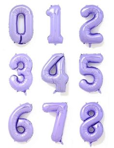 purple balloons are arranged in the shape of numbers