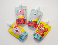 three baby bottles with cartoon characters on them