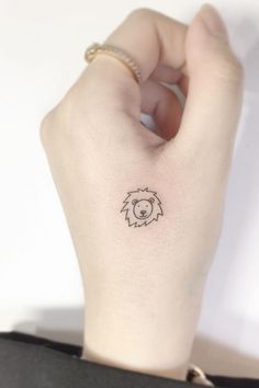 a person with a small tattoo on their wrist