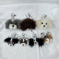 six key chains with different types of dogs and cats in them on a white sheet