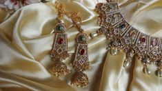 This elegant and gorgeous choker with matching earrings and tikka and is sure to be a hit for any event! The gorgeous multi and gold colors can match any outfit and the colors are gorgeous shades with a beautiful finish. Elegant Multicolor Kundan Lehenga, Multicolor Bollywood Choker For Party, Heavy Gold Lehenga For Party, Gold Temple Jewelry Style Lehenga For Parties, Gold Temple Jewelry Lehenga For Party, Wedding Multicolor Stone Work Choker, Gold Colors, Matching Earrings, Choker