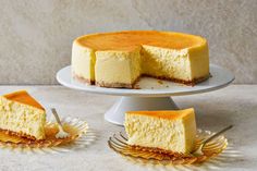 a cheesecake on a plate with two slices cut out