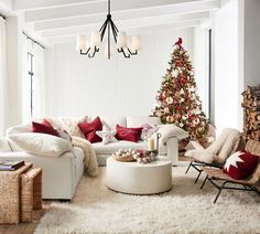 a living room filled with furniture and a christmas tree