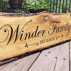 a wooden sign that says the winder family est lojos on it's side