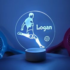 the illuminated soccer player is on display