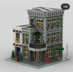 a lego model of a building with windows and balconies on the second floor