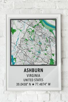 a white sign mounted to the side of a brick wall that says ashburn, virginia united states