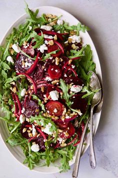 a salad with beets, feta cheese and nuts