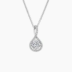 Diamond Pavé Twist Pendant - 18K White Gold. This romantic pendant features a round diamond shimmering within a sculptural twist of pavé diamonds. The center gem is prong-set at compass points and is delicately suspended from a lustrous precious metal chain. The number of diamonds and carat weight varies depending on the size of center gem (average 1/10 total carat weight). Halo Pendant, Solitaire Pendant, Precious Metal, Beautiful Necklace, Lab Created Diamonds, Jewelry Lover, Round Cut Diamond, Lab Diamonds, Office Wear