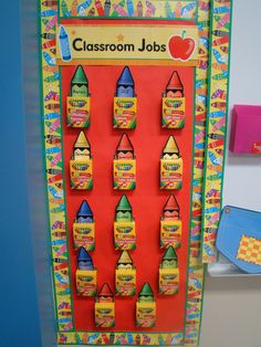 classroom jobs bulletin board with colorful crayons on the front and back wall,