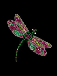 a pink and green dragonfly sitting on top of a black background