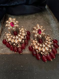 These antique Red Kundan earrings with red droplets will add the perfect charm to your festive wear. Length 8 cms Width 5.7 cms Weight 68 grams a pair Red Earrings Indian, Formal Red Pearl Earrings With Matching Set, Ruby Chandelier Earrings For Wedding, Red Earrings For Formal Festive Occasions, Red Festive Earrings For Formal Occasions, Red Formal Earrings For Festive Occasions, Elegant Red Chandelier Earrings For Festive Occasions, Elegant Red Festive Chandelier Earrings, Festive Red Elegant Chandelier Earrings