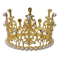 Make any occasion a royal one to remember with this mini metal crown. Whether it's to anoint a king for a day, to mark the sweet sixteen of a princess, to give the family a fantastical Christmas dinner, or just to dress up, anyone who wears this headgear will feel on top of the world. The rhinestones and pearls increase the imperial feel of this piece. When it's this fun, you can let it get to your head. Size: 4¾" x 3" Adjustable Tall Crown For Wedding, Princess Style Gold Jewelry For Party, Adjustable Wedding Crown, Princess Style Jewelry With Tall Crown Design, Regal Teardrop Crown Jewelry For Party, Regal Gold Headpiece For Party, Princess Style Wedding Crown With Structured Design, Gold Round Crown Headpiece As Gift, Princess Style Wedding Crown