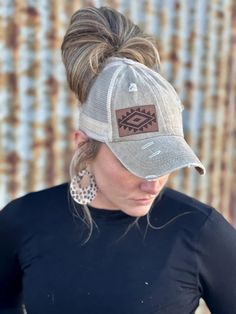 Step up your style game with our Western Aztec Baseball Cap! This distressed khaki cap comes with a genuine leather, laser engraved Aztec patch, adding a touch of personality to any outfit. Plus, the crisscross ponytail backing and velcro adjustable strap make for a comfortable and customizable fit. Upgrade your hat collection today! Made in USA Hat Ideas For Women, Womens Ball Caps, Ponytail Baseball Cap, Cowgirl Style Outfits, Laser Engraved Leather, Western Aztec, Hat Patches